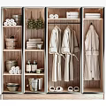 Organized Locker Storage With Hanging Robes Stacked Towels Toiletries Baskets Slippers And Green Plant Decor