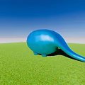 Blue Whale Shaped Garden Ornament On Lush Green Grass Under Clear Blue Sky