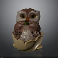 Brown And White Owl Figurine In Egg Shell With Green Accent And Yellow Eyes