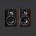 Modern Bookshelf Speakers With Red Wooden Finish And Black Speaker Cones On Reflective Surface
