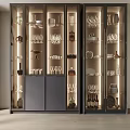 Elegant Modern Wine Cabinet With Glass Doors And Illuminated Display Of Wine Glasses Bottles