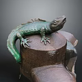 Green Reptile Lizard Statue Perched On Rusted Metal Pillar With Textured Surface