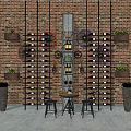 Metal Wine Rack with Brick Wall Background Bicycle Wheel Decor Planters Small Table and Stools