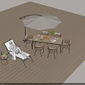 Outdoor Wicker Lounger Chair with Table Umbrella and Plants on Wooden Deck for Relaxation