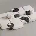 Beige Sectional Multi Person Sofa with Black Pillows Blankets and Small Round Side Table 3d model