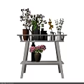 Decorative Vases With Various Flowers On Two Tiered White Shelf Arrangement