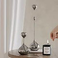 Sleek Silver Metal Candle Holders With Match Lighting Candle For Home Decor