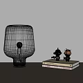 Modern White Glass Table Lamp with Decorative Figurines on Stacked Books
