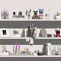 Decorative Candle Holders on White Shelves with Bear Figurine Deer Statue Books and Small Plant