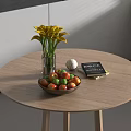 Fruit Bowl on Round Wooden Table With Yellow Calla Lilies Vase Notebook and Decorative Ball