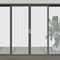 Black Framed Sliding Doors with Vertical Glass Slats in Modern Interior and Potted Plant