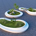 White Irregular Shaped Garden Planters With Green Plants Stones And People Sitting On Paved Ground