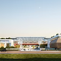 Modern School Building With Green Roof And Outdoor Courtyard For Student Activities