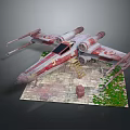 X Wing Starfighter Model With Red White Weathered Paint On Brick Base And Green Plants