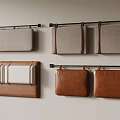 Wall Mounted Fabric And Leather Cushions On Metal Rods Against Neutral Wall