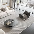 Modern Cream Sofa And Round Black Coffee Table Set With Striped Rug And Footstool