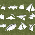 White Tensile Membrane Structures in Outdoor Grass Field With Various Geometric Shapes