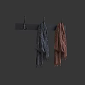 Stylish Winter Scarves in Gray and Brown Hanging on Black Hook Rack