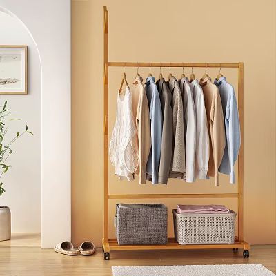 Organized Clothes Rack with Hanging Shirts Tops and Storage Baskets in Bedroom 3d model