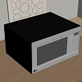 Modern Kitchen Microwave Oven in Black and Silver on Wooden Countertop