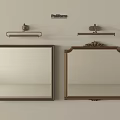 Two Elegant Framed Mirrors With Metal And Ornate Designs And Wall Mounted Lights