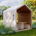 Outdoor Shelter with White Exterior and Wooden Interior Bench Table Surrounded by Green Grass Trees Plants