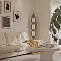 Modern Open Plan Living And Dining Room With White Sofa Decorative Paintings And Monstera Plant