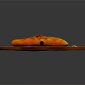 Golden Brown Stuffed Flatbread With Charred Spots On Red Ceramic Plate