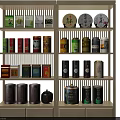 Organized Tea Storage Items on Beige Shelf with Colorful Tea Cans Decorative Plates And Boxes