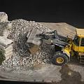 Yellow Loader At Construction Site With Rubble Pile And Large Stones