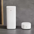 White MI Smart Devices On Tabletop With Gray Background And Wooden Accents