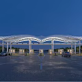 Modern Large Canopy Gateway At Night With Illuminated Lanes And Vehicles