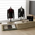 Stylish Formal Suits and Shirts on Mannequins with Handbag Wallet Phone at Display Table by Window