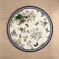 Elegant Round Rug With Floral And Bird Patterns On Wooden Floor With Green Plant