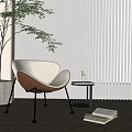 Upholstered Accent Chair with Potted Plant White Blinds Wooden Floor Small Round Table and Books