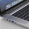 Sleek Apple Laptop Open Screen Showing Galaxy Display With Silver Body And Desktop Icons