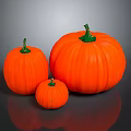 Fresh Orange Pumpkins of Various Sizes with Green Stems Displayed on Gray Surface