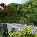 Stone Arch Bridge Surrounded by Green Mountains and River with Trees and Vegetation