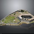 Historical Ancient Fortress Structure With Encircling Walls Green Grass And Trees