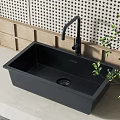 Black Single Bowl Kitchen Sink With Modern Faucet On Countertop And Green Plants