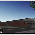 Red Brick Industrial Factory Building With Large Glass Windows Gray Roof And Surrounding Greenery