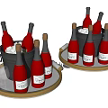 Wine Bottles and Wine Glasses with Ice Buckets and Ice Cubes on Gold Trays
