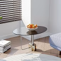 Round Black Top Side Table With Gold Base Metal Frame In Sunlit Living Room