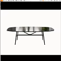 Black Oval Dining Table With Smooth Tabletop And Modern Metal Frame Design