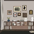 Elegant Decorative Cabinet Featuring Books Framed Artworks Vase Table Lamp And Home Decor