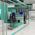 Green Exhibition Booth With Metal Frame Display Cabinets Screens And Man In Suit