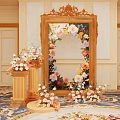 Elegant Photo Spot With Ornate Gold Frame Mirror Fresh Flowers And Decorative Pedestals