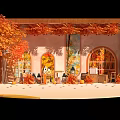 Autumn Themed Photo Spot With Wooden Frame Arched Windows Orange Leaves And Tables