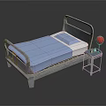 Hospital Medical Bed With Blue Mattress Safety Rails And Side Table