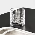 Modern Desk With Black Top Wooden Legs Brown Leather Chair Open Book And Glass Cup